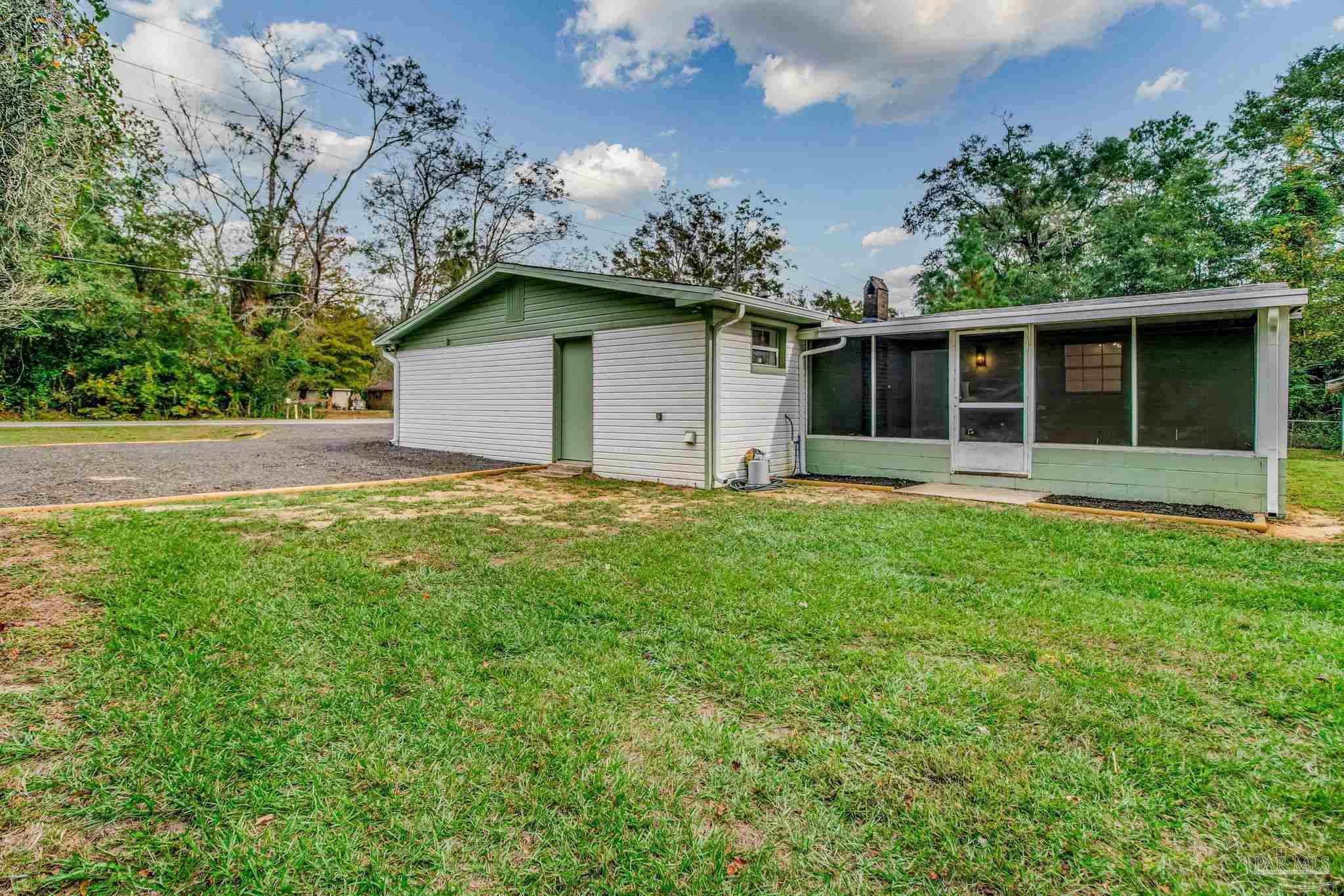 4355 Highway 95A North Molino, FL 32577 - Photo 52 of 54 a house with a yard