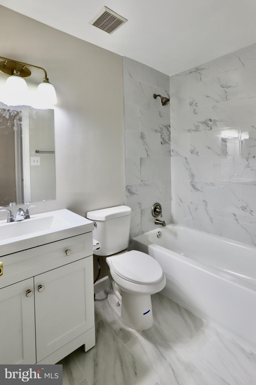 7442 Broken Staff Columbia, MD 21045 - Photo 14 of 28 a bathroom with a sink toilet and shower