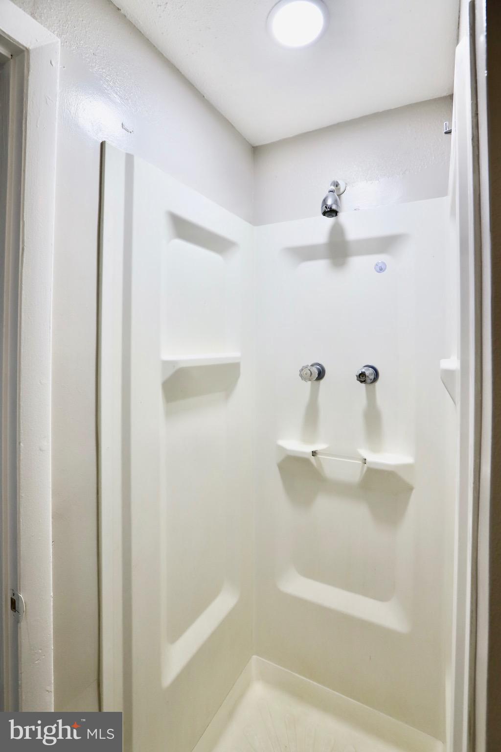 7442 Broken Staff Columbia, MD 21045 - Photo 18 of 28 a bathroom with a shower