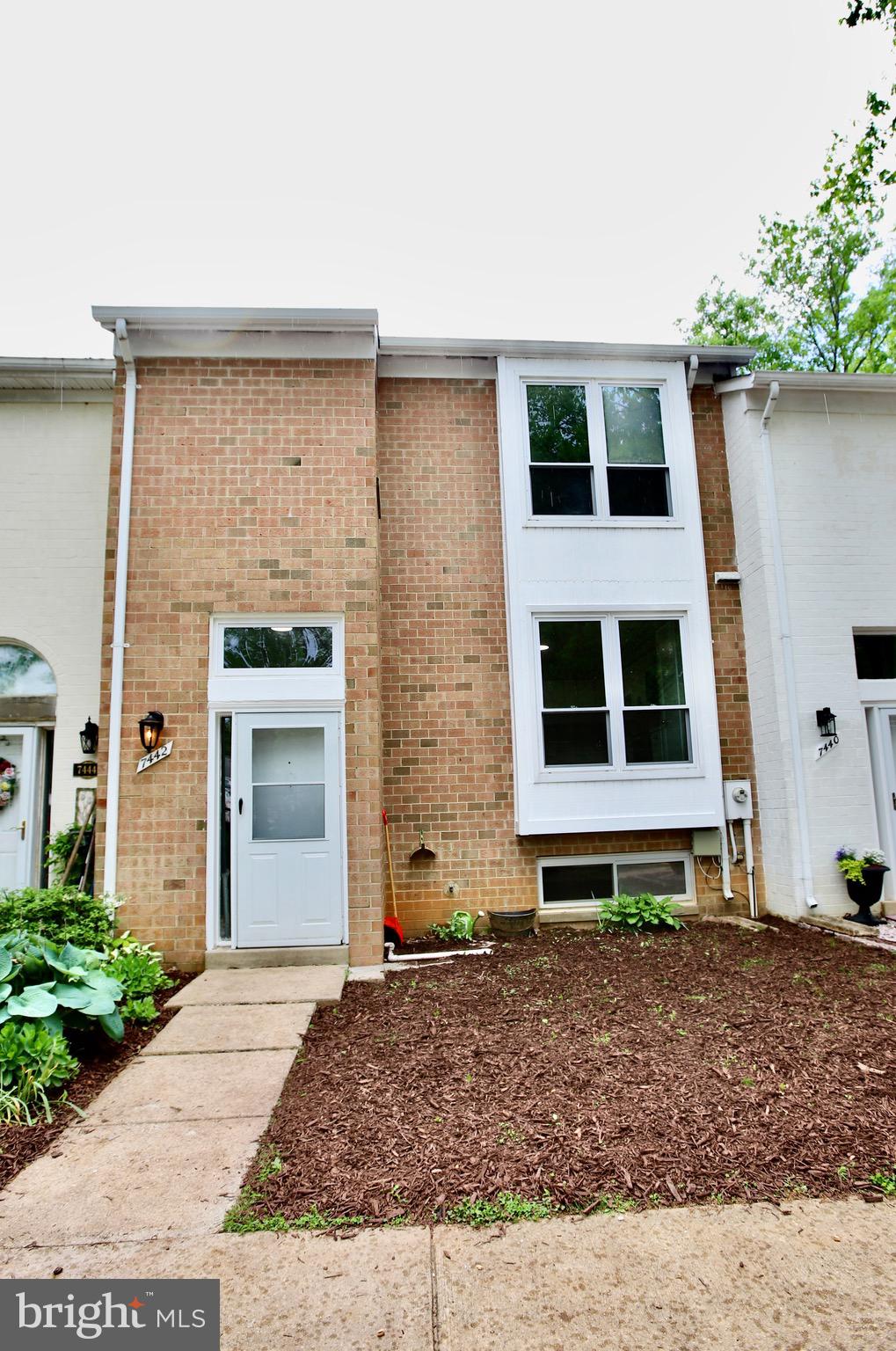 7442 Broken Staff Columbia, MD 21045 - Photo 2 of 28 a front view of a house with a yard