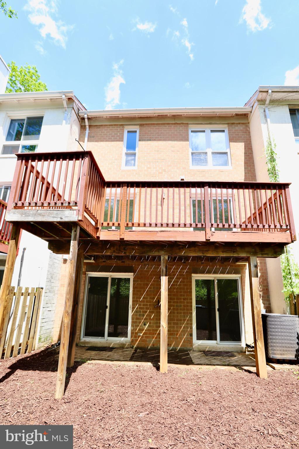 7442 Broken Staff Columbia, MD 21045 - Photo 23 of 28 a view of a house with wooden deck