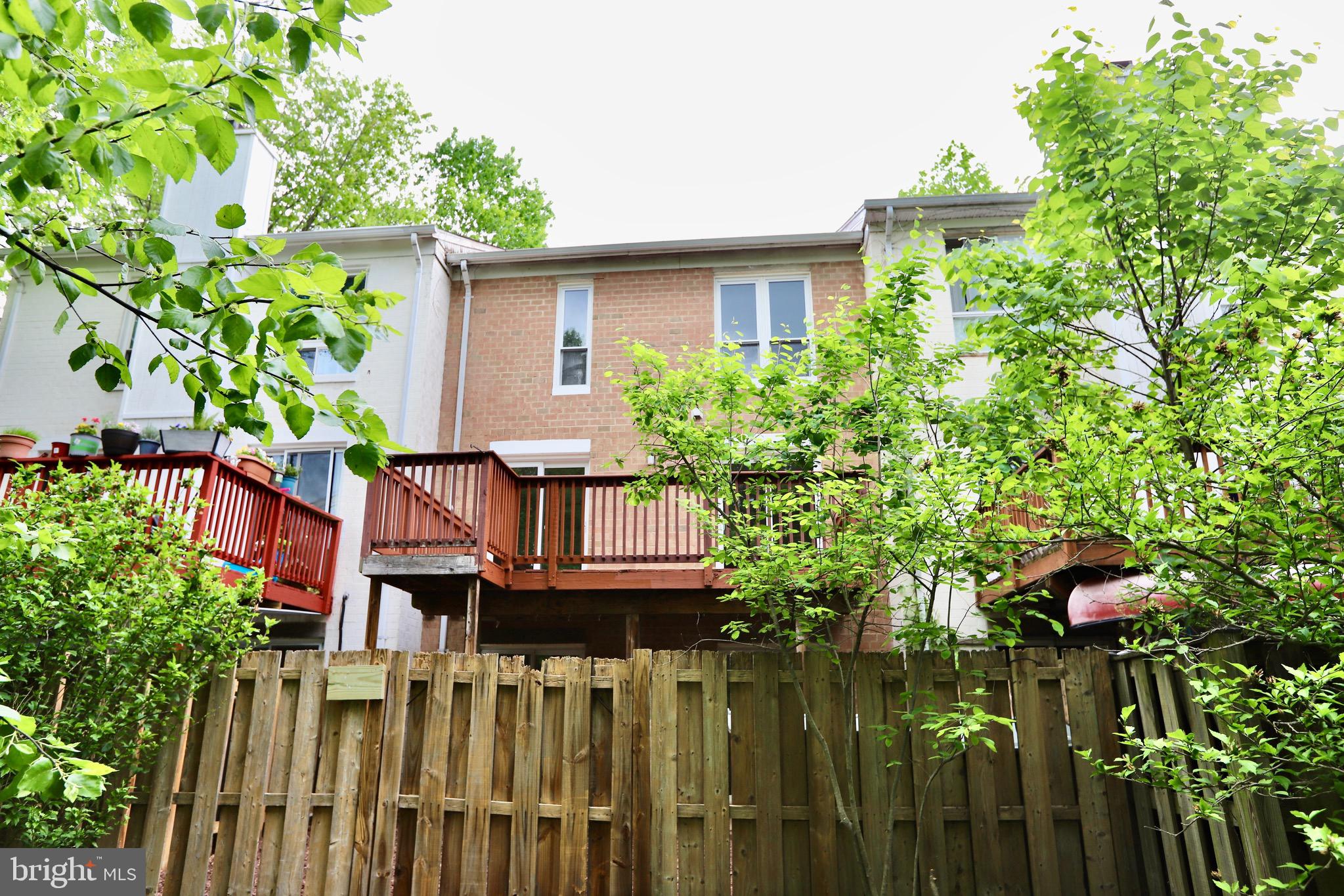 7442 Broken Staff Columbia, MD 21045 - Photo 24 of 28 a view of a house with wooden fence