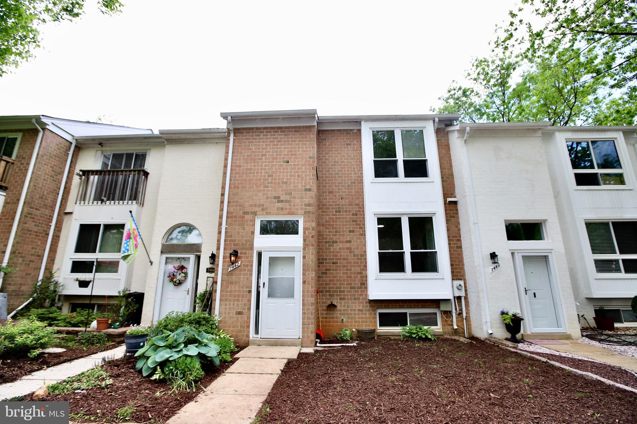 7442 Broken Staff Columbia, MD 21045 - Photo 3 of 28 a front view of a house with a yard