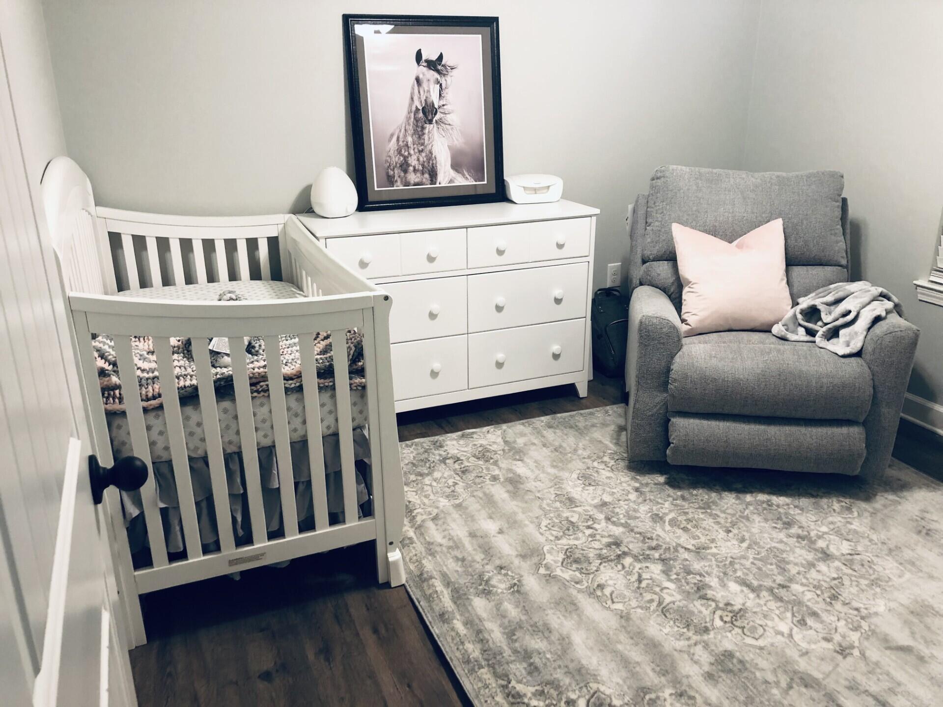 4948 Guernsey Road Pace, FL 32571 - Photo 14 of 25 a bedroom with a bed with wooden floor