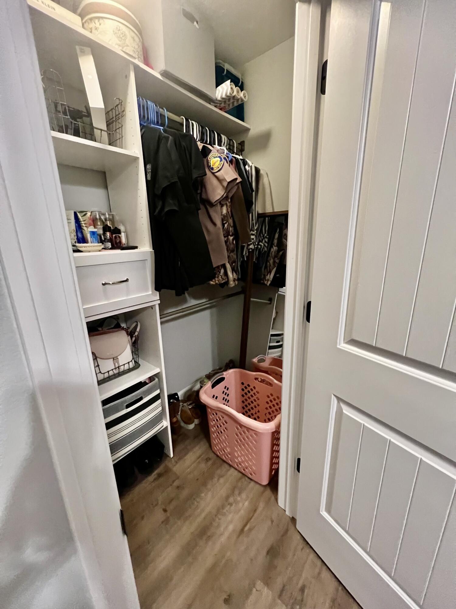 4948 Guernsey Road Pace, FL 32571 - Photo 21 of 25 a view of walk in closet with clothes and shoes