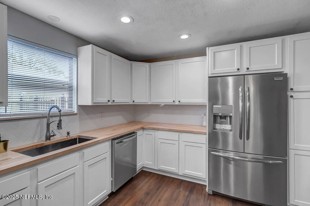 4518 Crosstie Road South Jacksonville, FL 32257 - Photo 14 of 28 a kitchen with cabinets stainless steel appliances and a sink