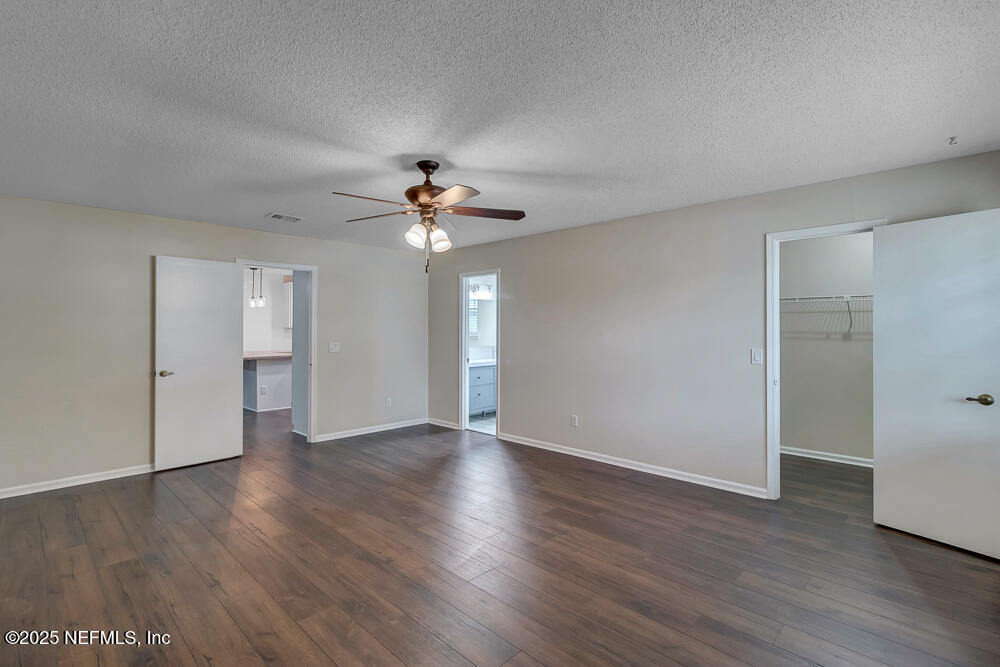4518 Crosstie Road South Jacksonville, FL 32257 - Photo 17 of 28 a view of an empty room with wooden floor