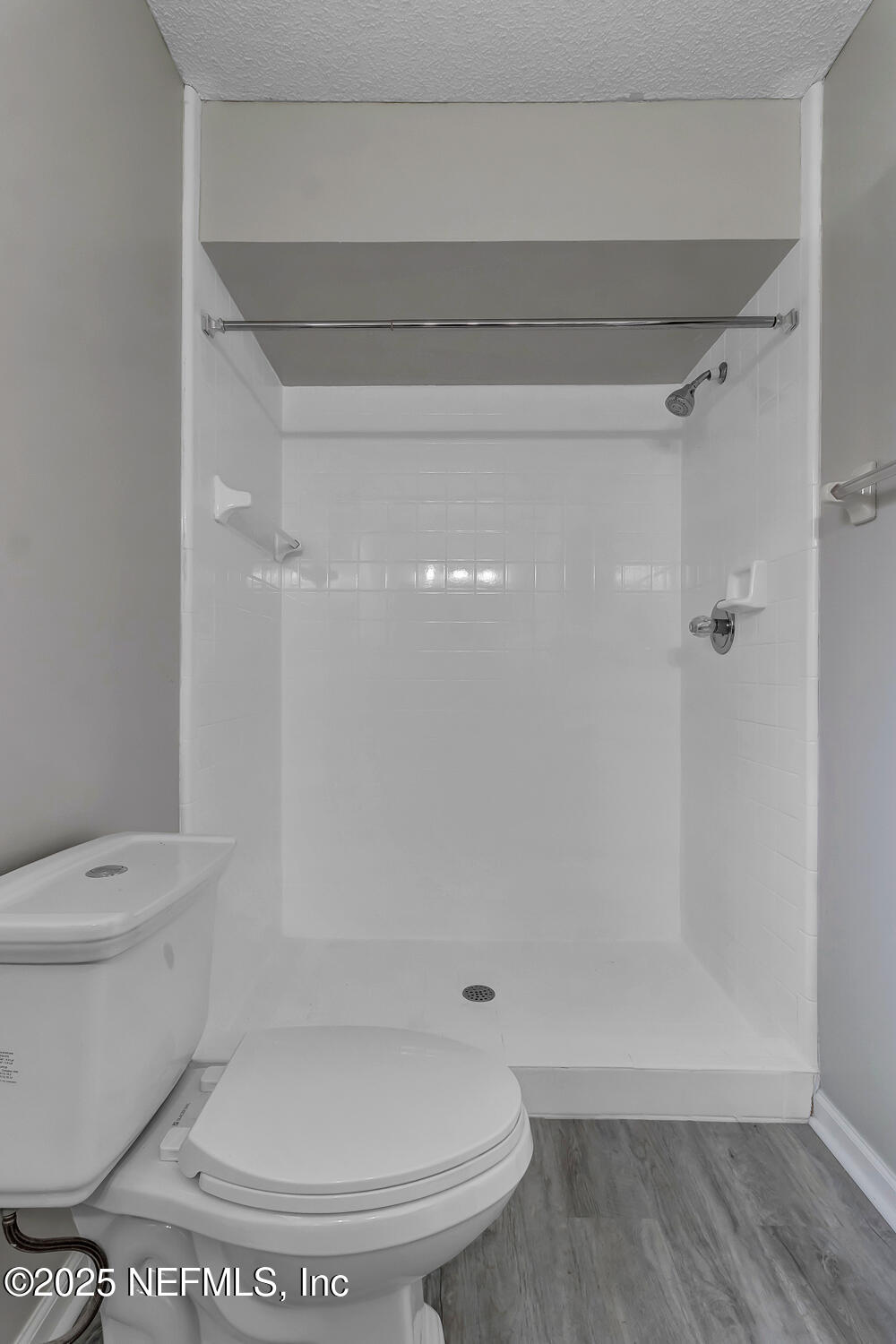 4518 Crosstie Road South Jacksonville, FL 32257 - Photo 19 of 28 a bathroom with a toilet and a shower