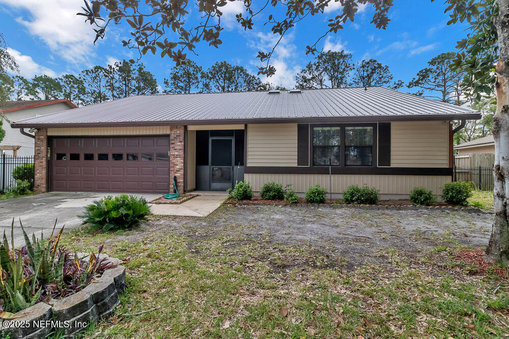 4518 Crosstie Road South Jacksonville, FL 32257 - Photo 2 of 28 front view of a house with a yard
