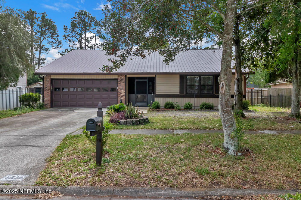 4518 Crosstie Road South Jacksonville, FL 32257 - Photo 3 of 28 a front view of a house with garden
