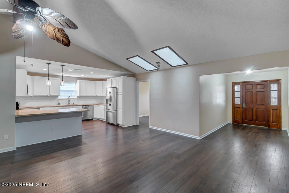 4518 Crosstie Road South Jacksonville, FL 32257 - Photo 5 of 28 a room with stainless steel appliances kitchen island wooden floors and view living room