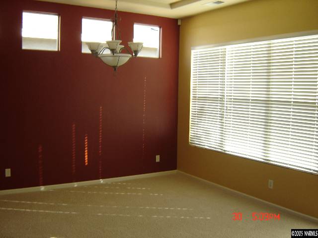 9661 Shadowstone Way Reno, NV 89521 - Photo 4 of 9 a view of empty room with window
