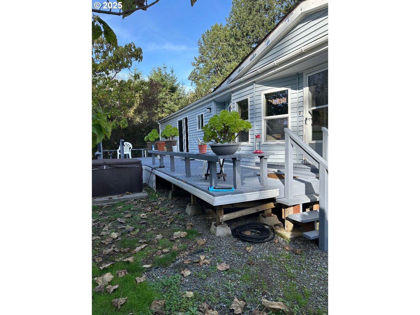a backyard of a house with outdoor seating