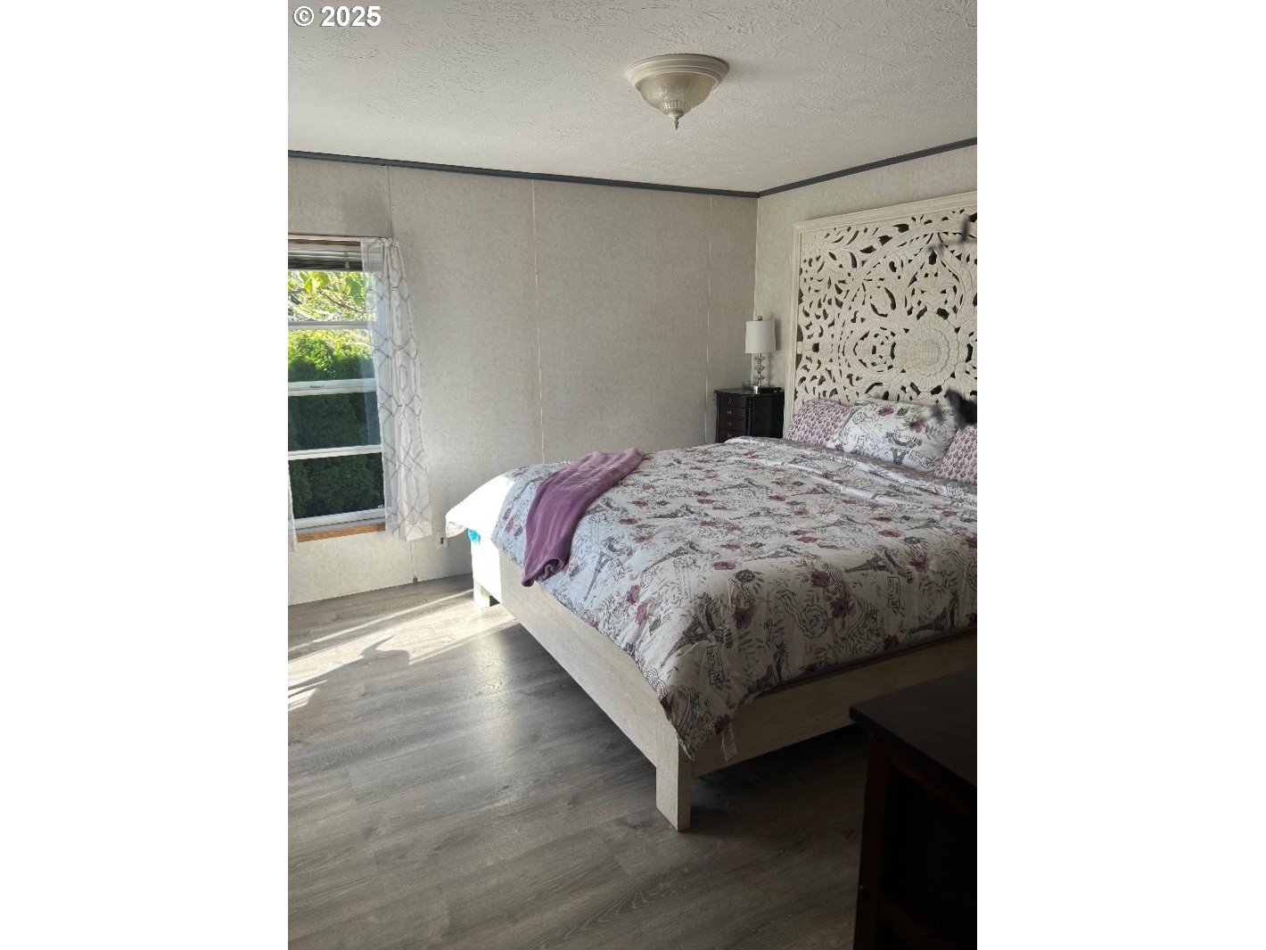 96465 Coverdell Road, Unit 20 Brookings, OR 97415 - Photo 12 of 21 a bedroom with a bed and a window