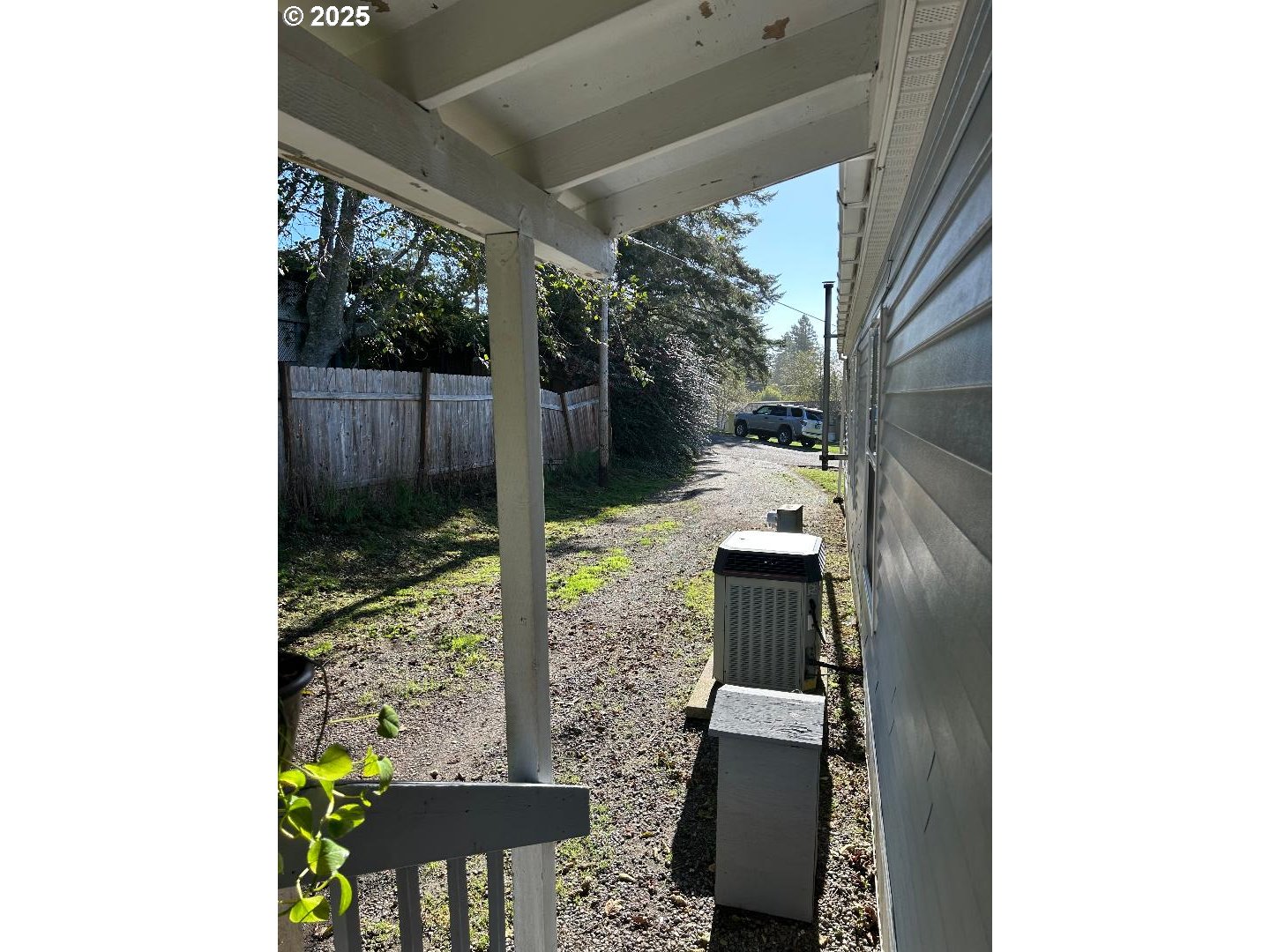 96465 Coverdell Road, Unit 20 Brookings, OR 97415 - Photo 16 of 21 a vase of flowers sitting on a table in front of a window