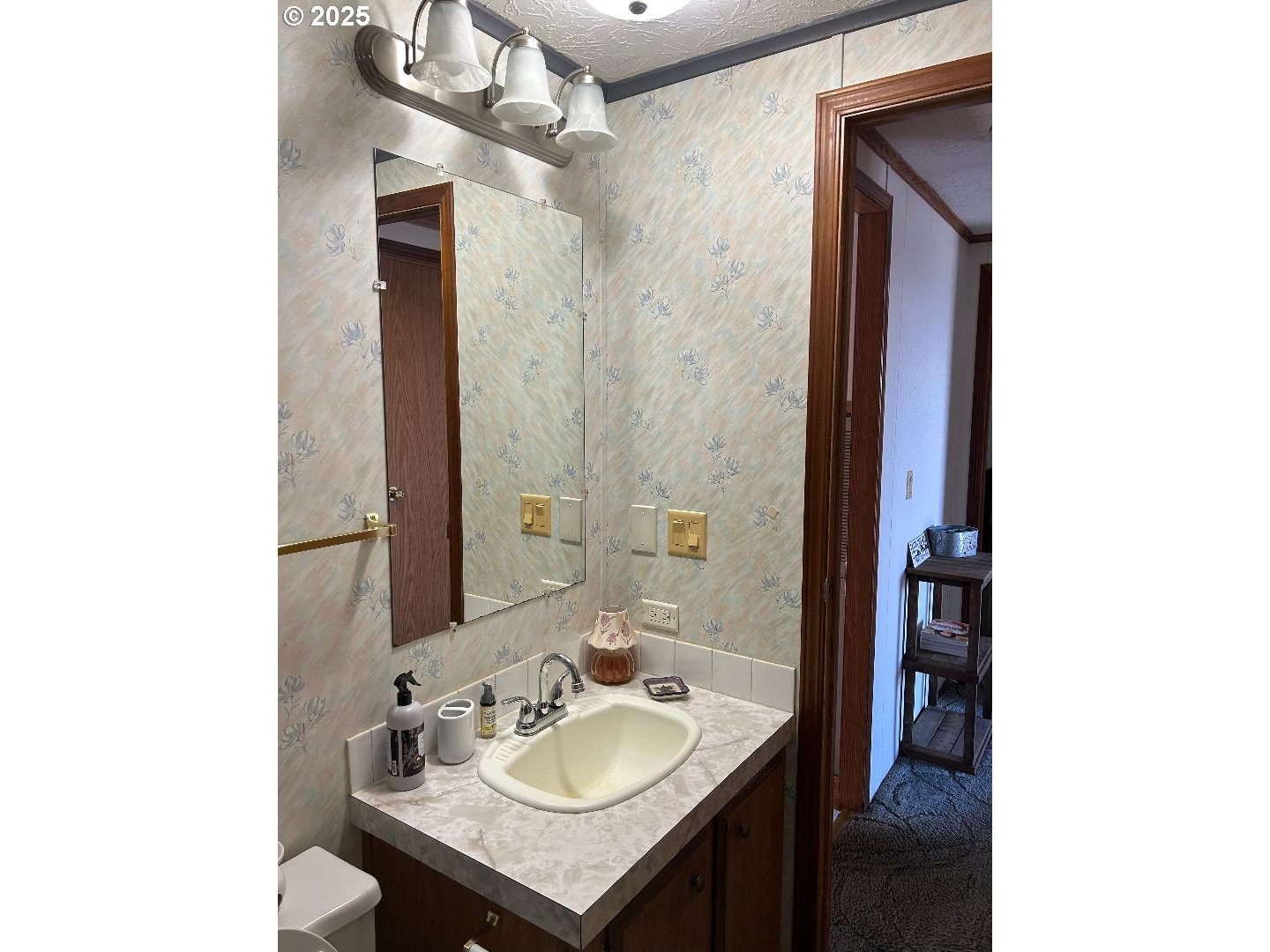 96465 Coverdell Road, Unit 20 Brookings, OR 97415 - Photo 18 of 21 a bathroom with a sink and a mirror