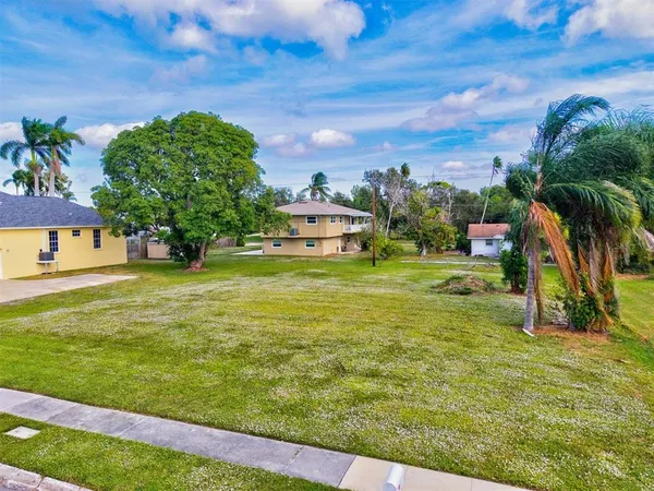 a view of a swimming pool with a yard