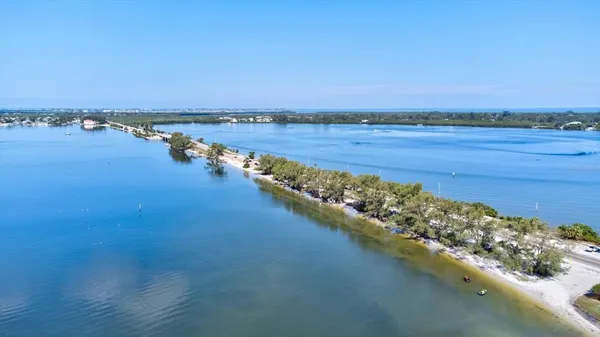 a view of a lake with outdoor seating