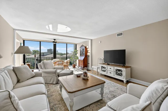 a bedroom with a bed and a chair