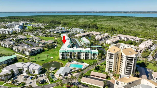 a view of a swimming pool with chairs in patio