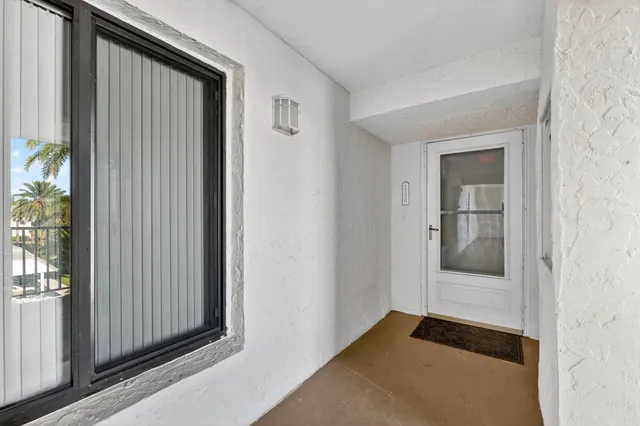 a kitchen with stainless steel appliances kitchen island granite countertop a stove a sink and a microwave