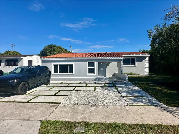 a front view of a house with a patio