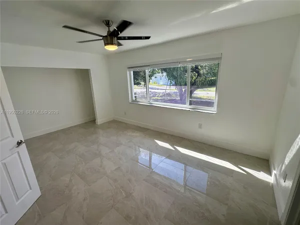 a bathroom with a shower sink and mirror