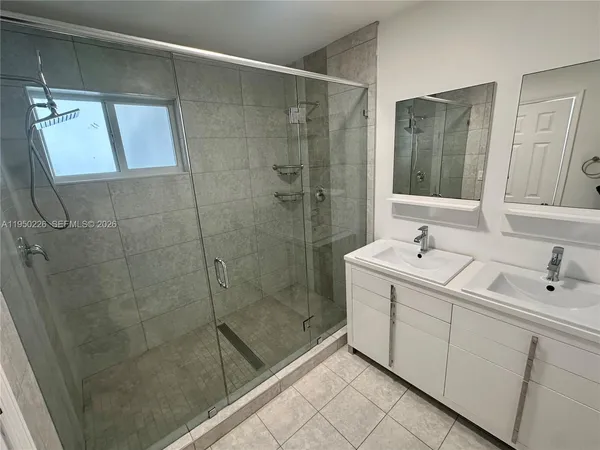 a bathroom with a shower and toilet
