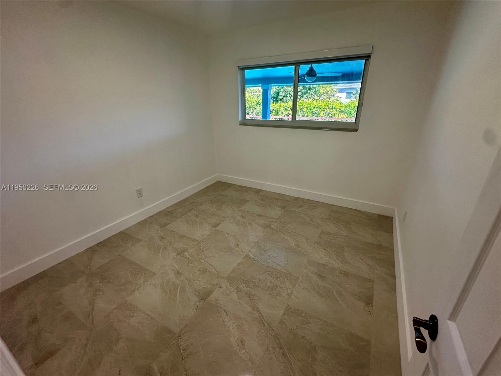 1811 Southwest 83rd Avenue Miami, FL 33155 - Photo 16 of 24 an empty room with windows