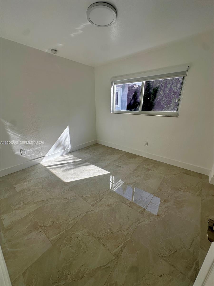 1811 Southwest 83rd Avenue Miami, FL 33155 - Photo 17 of 24 a view of a livingroom with wooden floor and a window