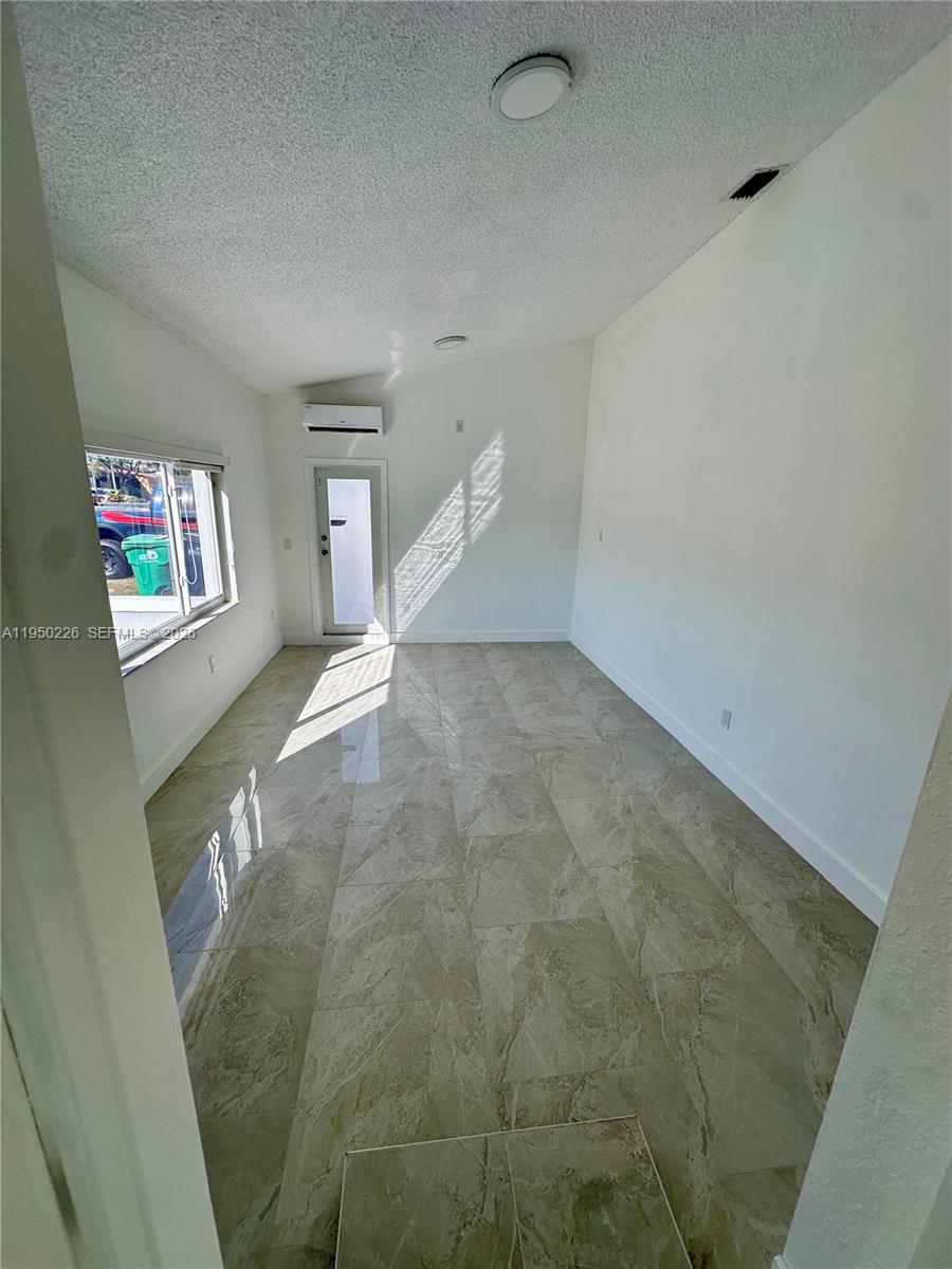 1811 Southwest 83rd Avenue Miami, FL 33155 - Photo 19 of 24 a view of an empty room and window