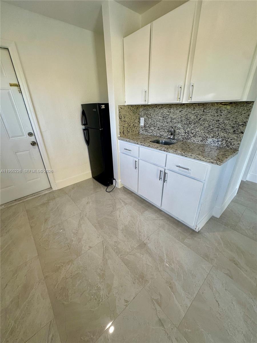 1811 Southwest 83rd Avenue Miami, FL 33155 - Photo 21 of 24 a view of cabinets with wooden floor