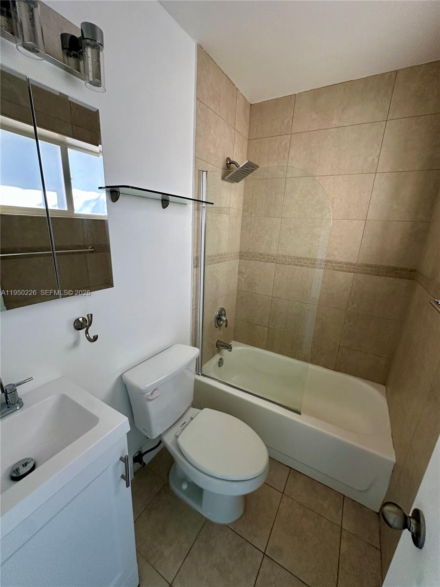 1811 Southwest 83rd Avenue Miami, FL 33155 - Photo 22 of 24 a bathroom with a toilet sink and shower