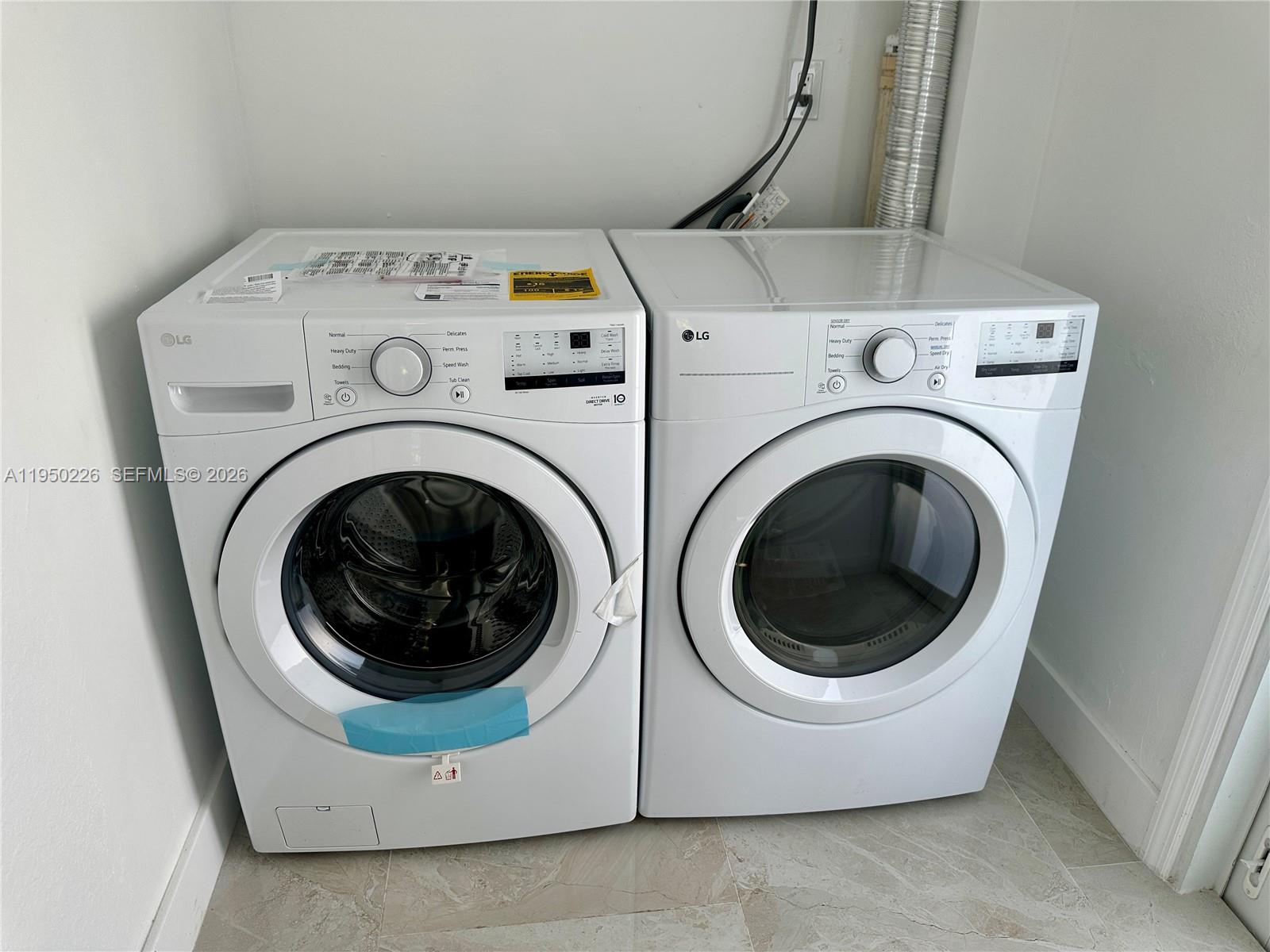 1811 Southwest 83rd Avenue Miami, FL 33155 - Photo 23 of 24 a utility room with dryer and washer