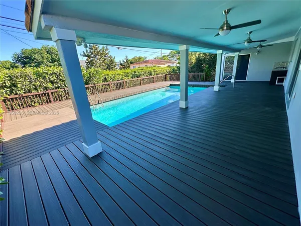 a view of a porch with wooden floor