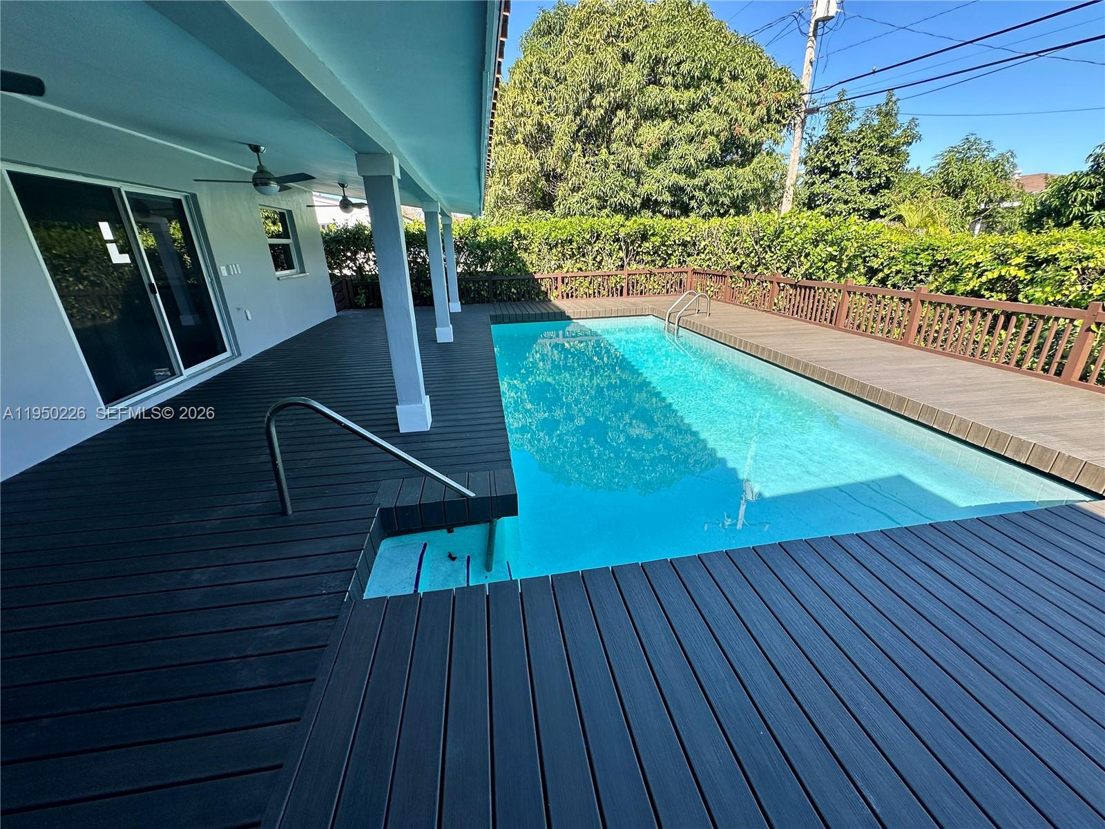 1811 Southwest 83rd Avenue Miami, FL 33155 - Photo 5 of 24 a view of balcony with wooden floor