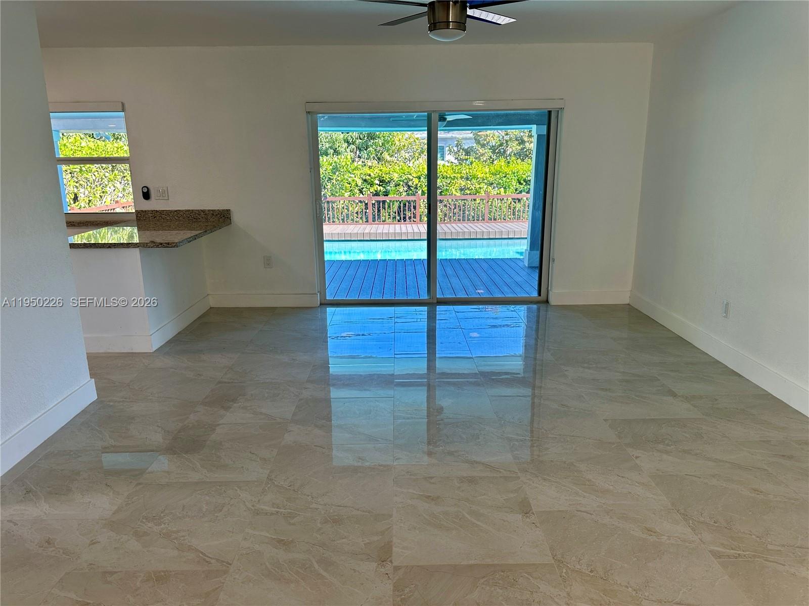 1811 Southwest 83rd Avenue Miami, FL 33155 - Photo 9 of 24 an empty room with windows