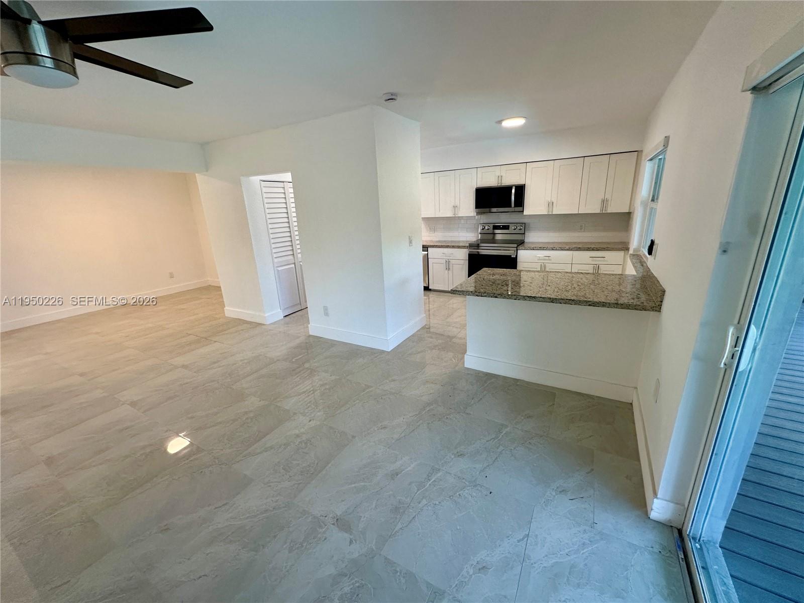 1811 Southwest 83rd Avenue Miami, FL 33155 - Photo 10 of 24 a view of kitchen with stainless steel appliances refrigerator oven