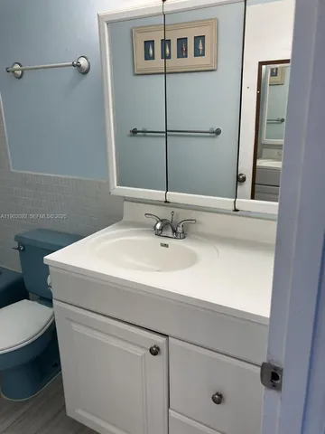 a bathroom with a sink and mirror