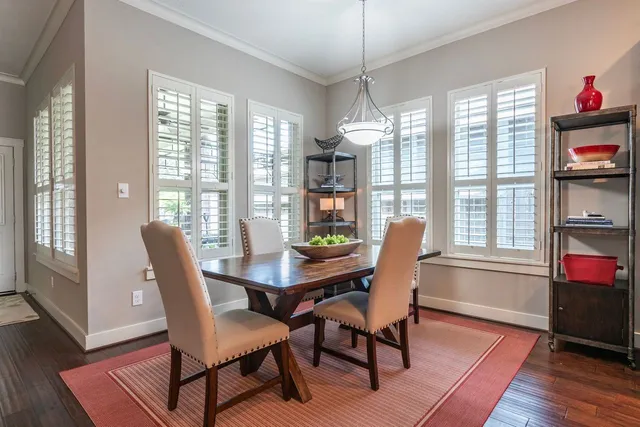 a dining room with furniture window wooden floor