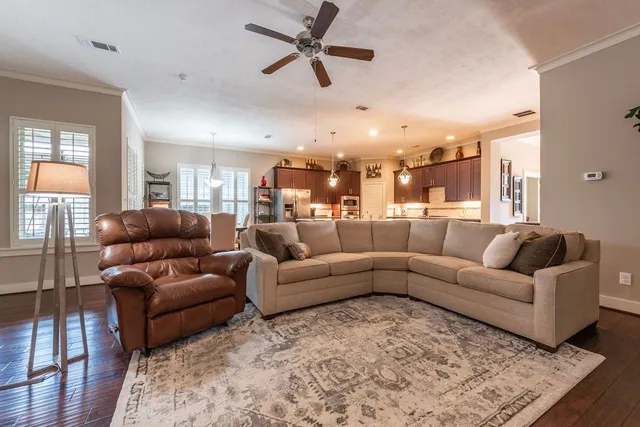 a living room with furniture and a rug