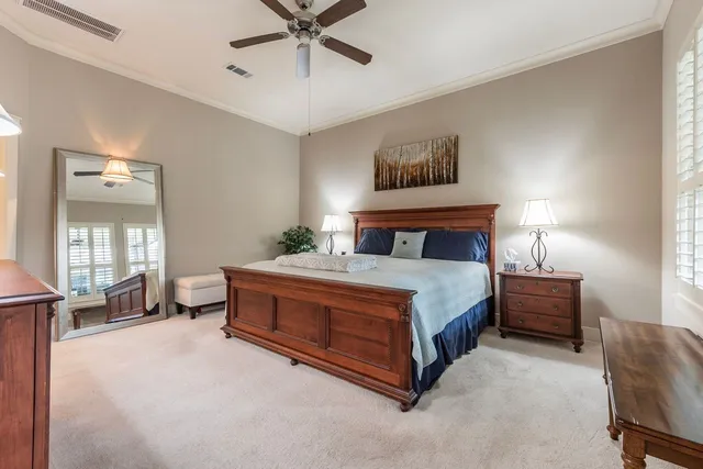 a bedroom with a bed and dresser