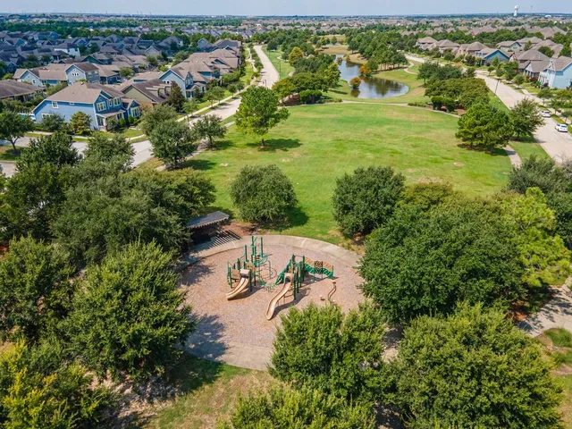 an aerial view of a house with a lake view