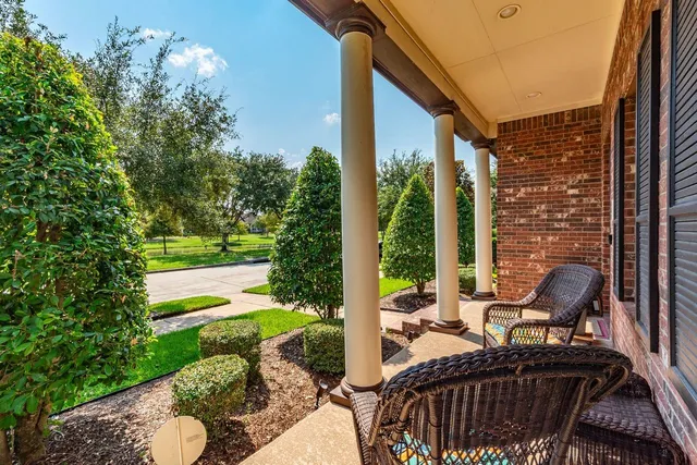 a view of an outdoor sitting area with furniture