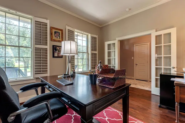 a room with dining table and chairs