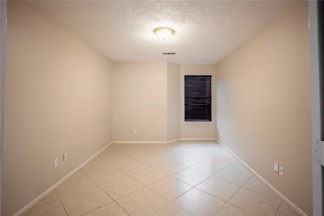 a view of an empty room with a fireplace