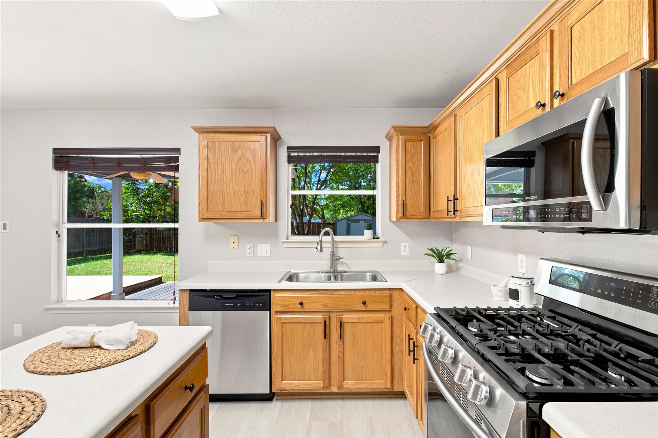1608 Melibee Trail Austin, TX 78748 - Photo 6 of 22 Kitchen featuring windows overlooking back patio and yard.