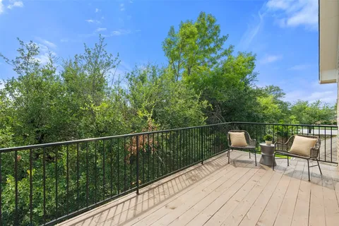 a view of balcony with furniture