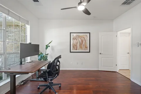 a workspace with furniture and a window