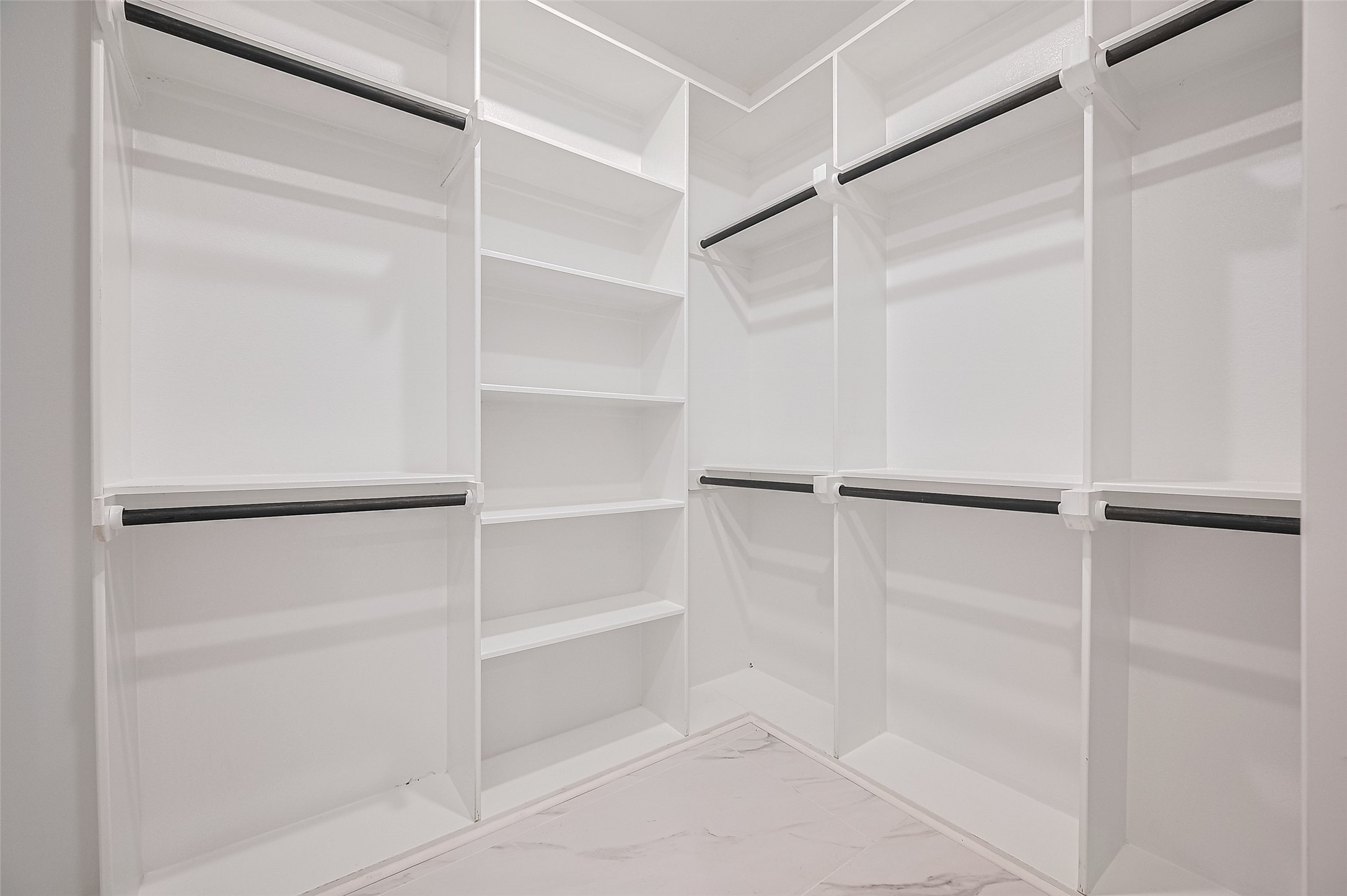 6747 Liverpool Street Houston, TX 77021 - Photo 18 of 18 This oversized walk-in closet includes open shelving and hanging areas for easy and organized storage.